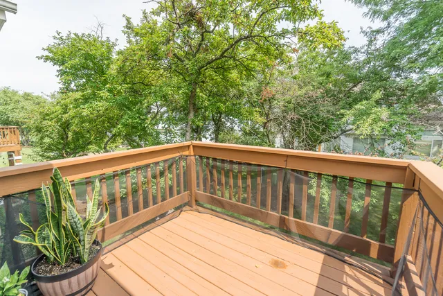 a view of a balcony with wooden floor