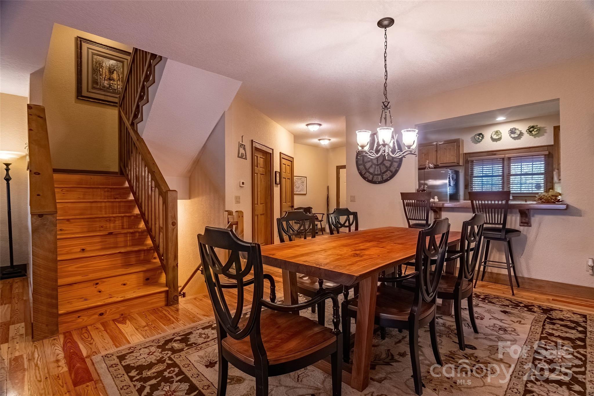 620 Sapphire Valley Road Sapphire, NC 28774 - Photo 11 of 48 a dining room table chair and a chandelier