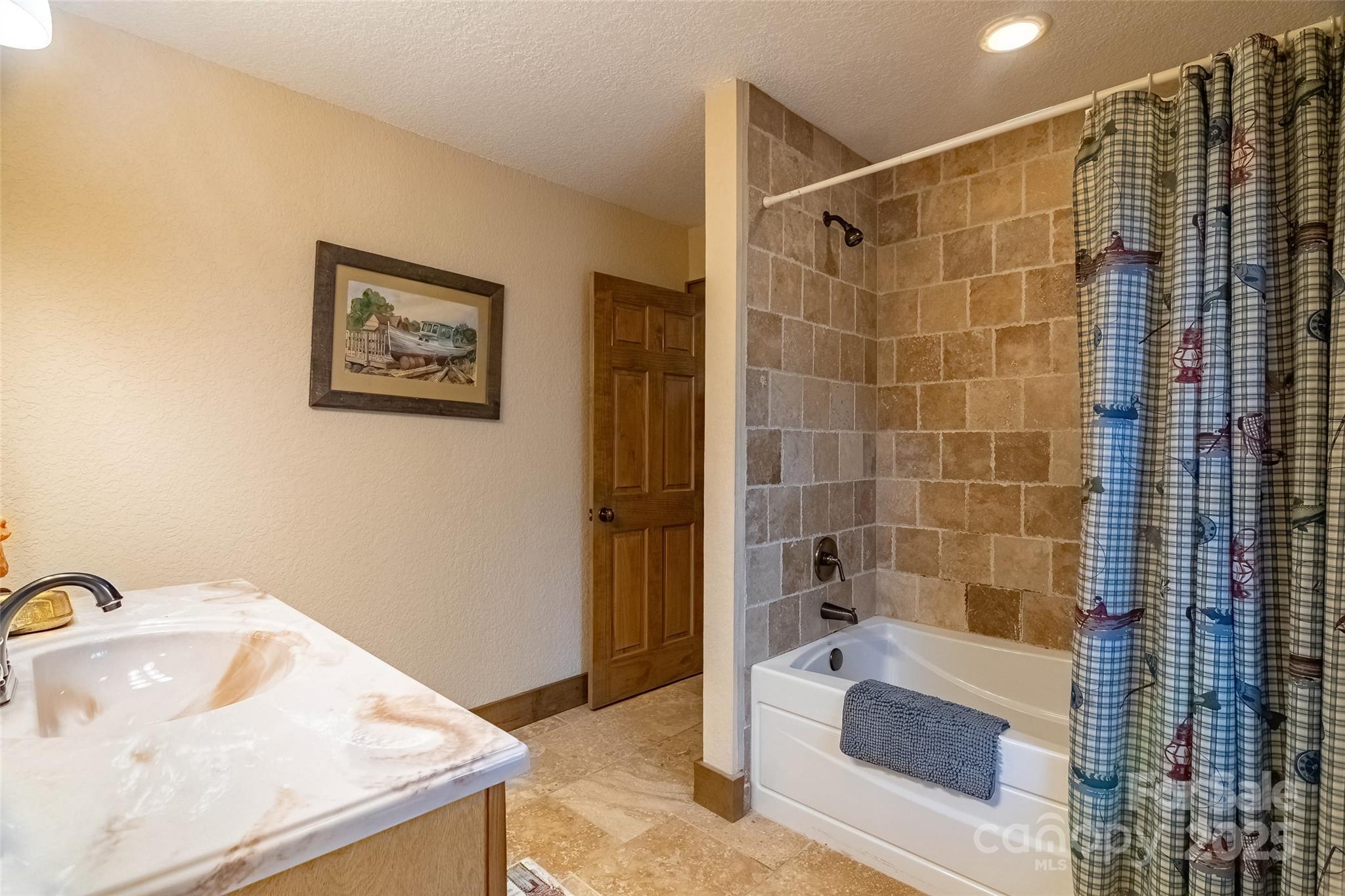 620 Sapphire Valley Road Sapphire, NC 28774 - Photo 26 of 48 a bathroom with a tub shower and sink