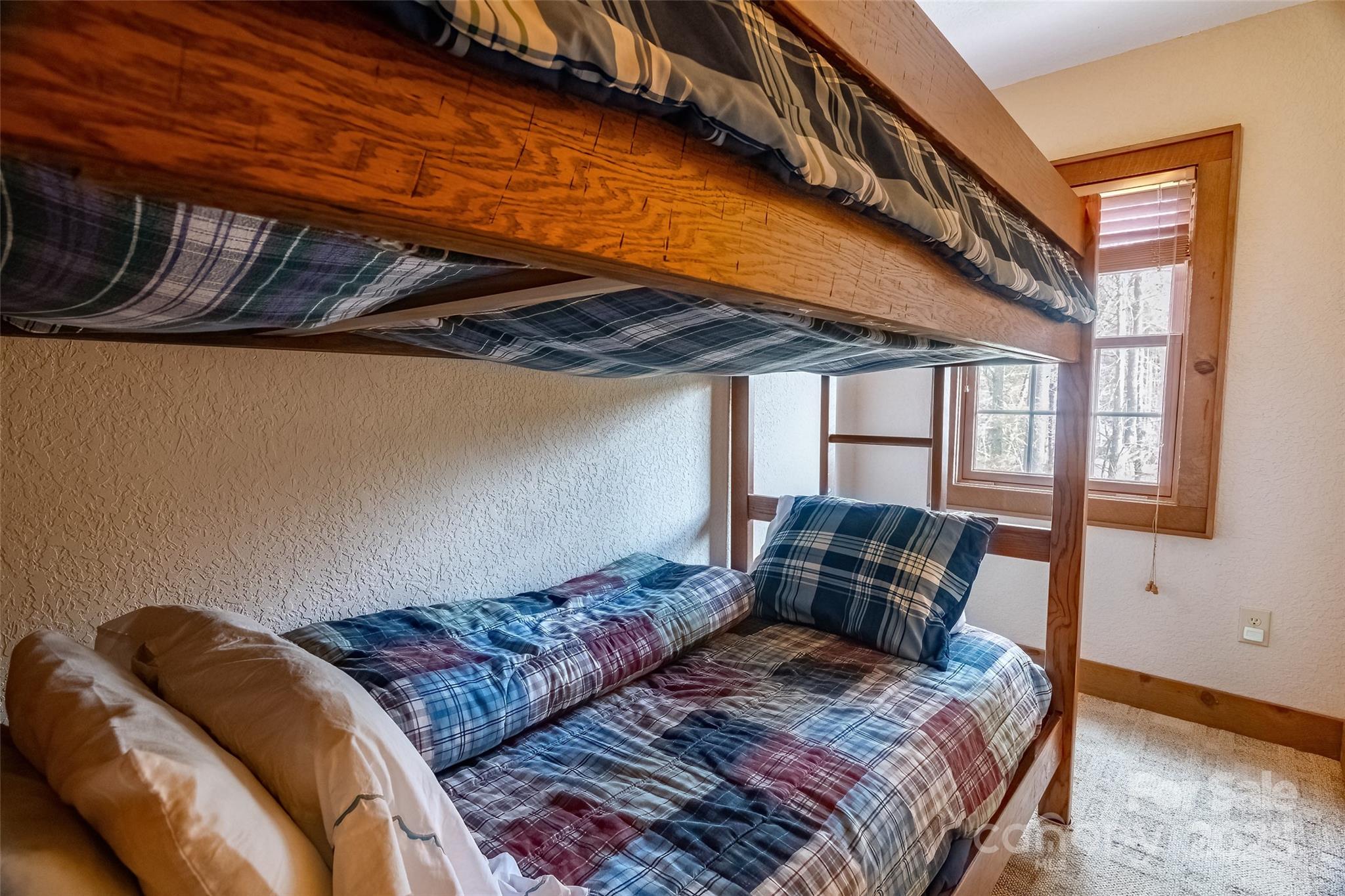620 Sapphire Valley Road Sapphire, NC 28774 - Photo 33 of 48 a bedroom with bed and balcony