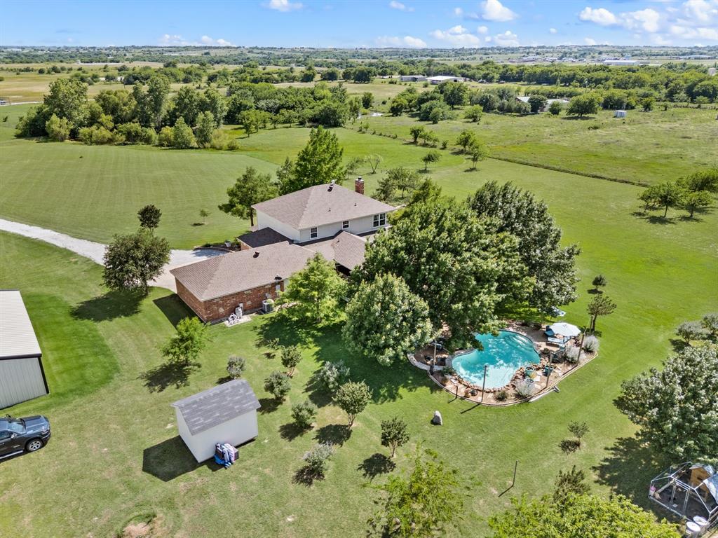 2141 Old Denton Road Decatur, TX 76234 - Photo 1 of 40 Aerial view of property featuring residen, a freeform swimming pool, a metal building, a storage shed.