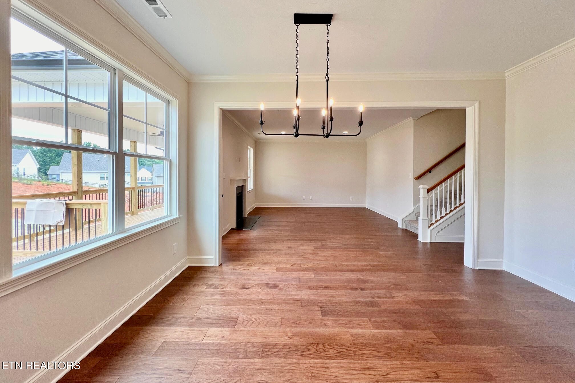 1209 Madison Oaks Road Knoxville, TN 37924 - Photo 15 of 35 a view of empty room with wooden floor and fan