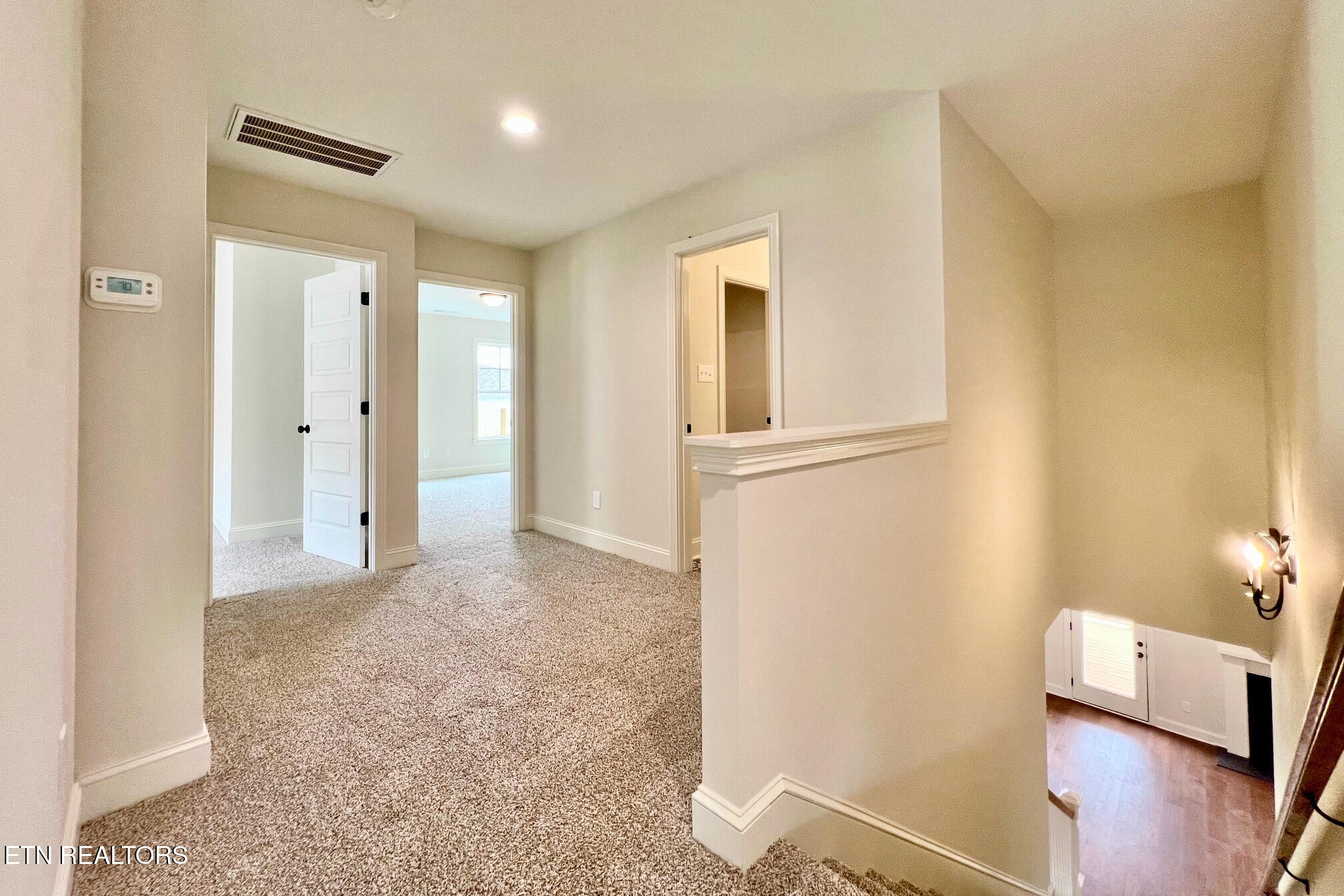 1209 Madison Oaks Road Knoxville, TN 37924 - Photo 23 of 35 a view of a livingroom with wooden floor and a bathroom