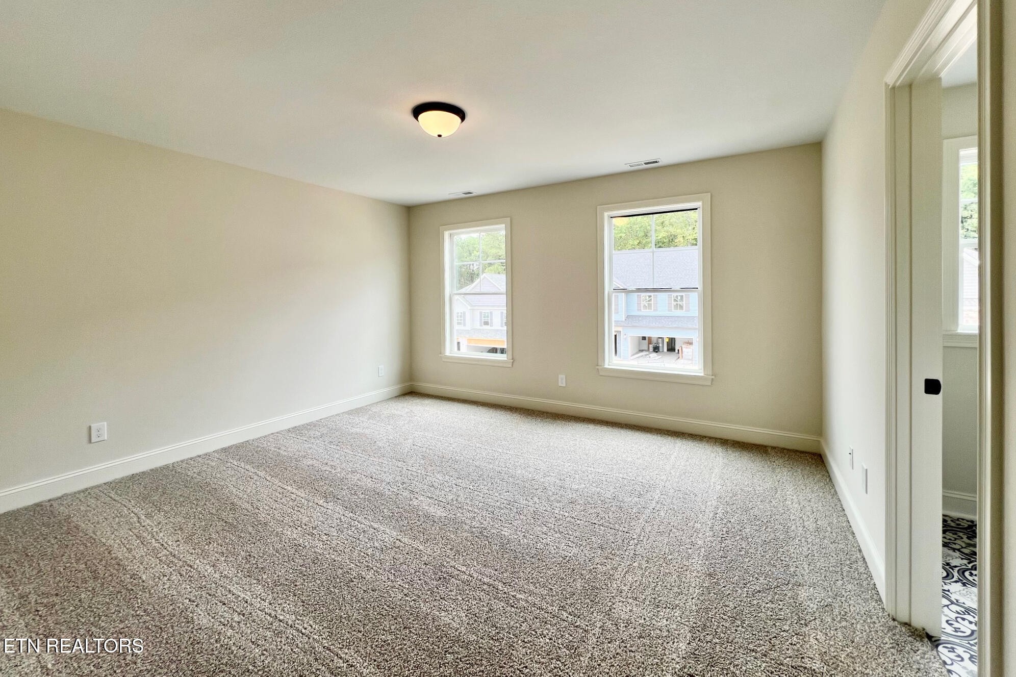 1209 Madison Oaks Road Knoxville, TN 37924 - Photo 24 of 35 an empty room with windows and closet