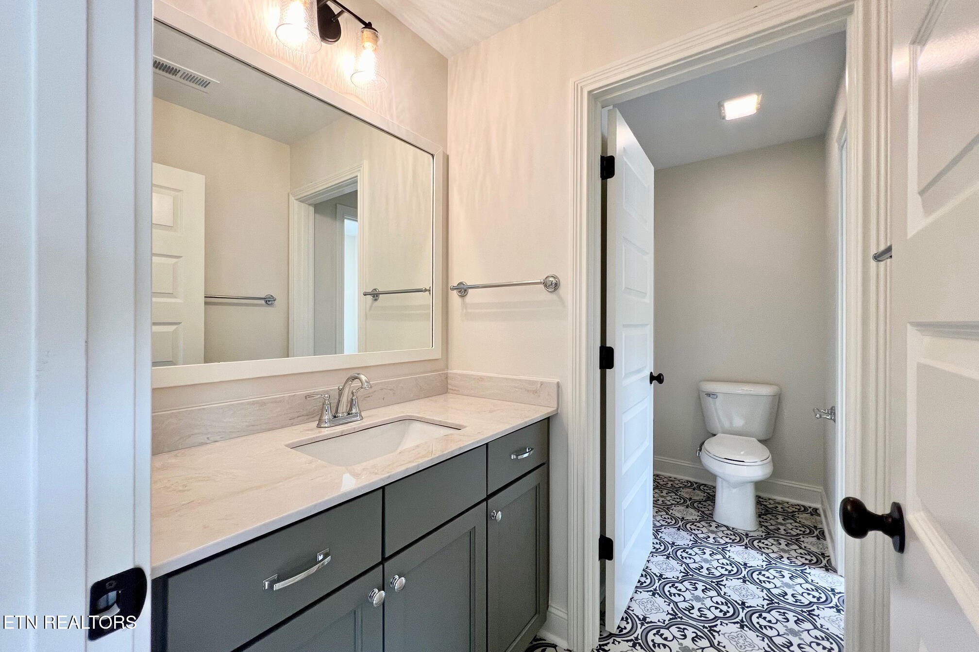 1209 Madison Oaks Road Knoxville, TN 37924 - Photo 27 of 35 a bathroom with a sink a toilet and shower