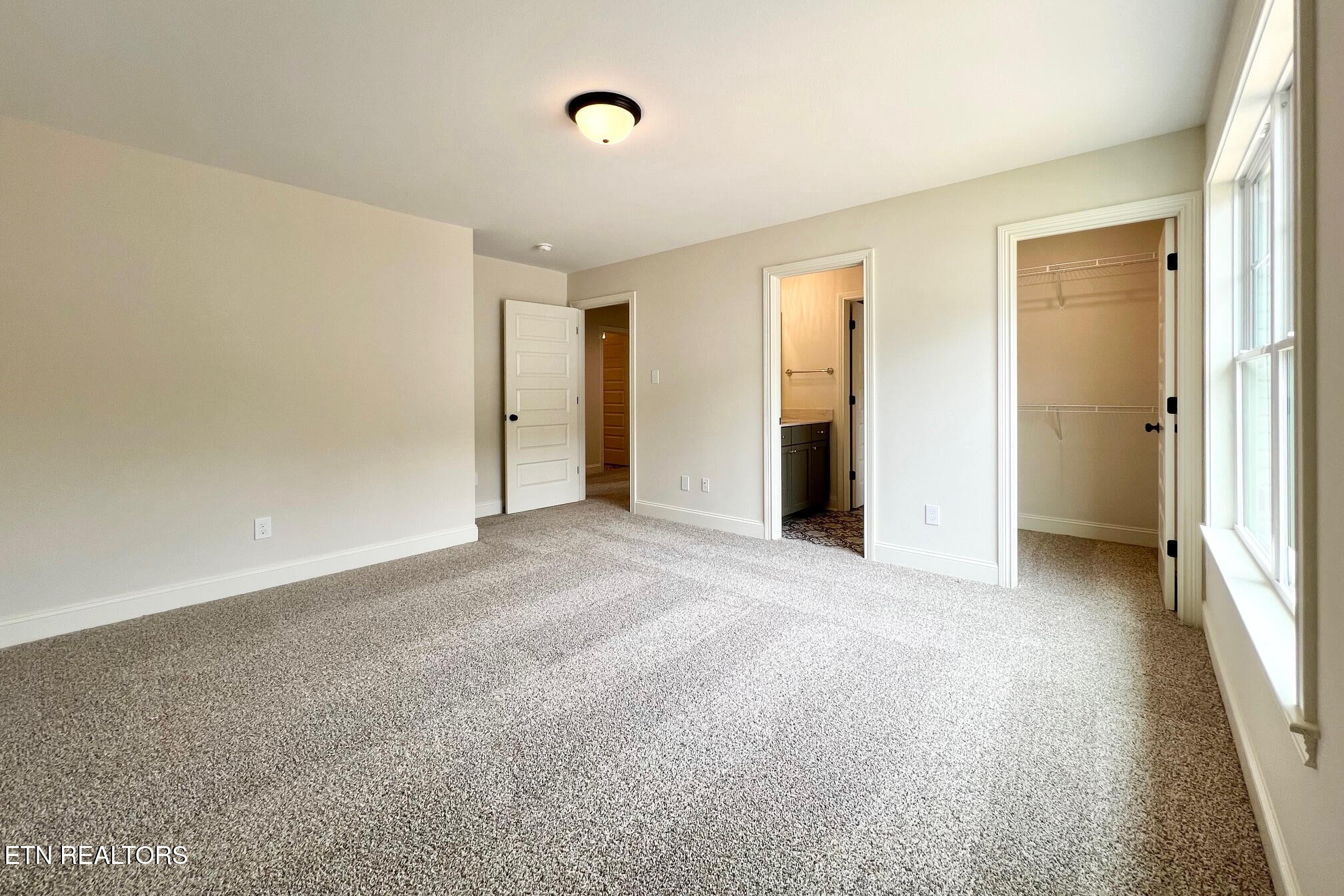1209 Madison Oaks Road Knoxville, TN 37924 - Photo 28 of 35 an empty room with closet and a window
