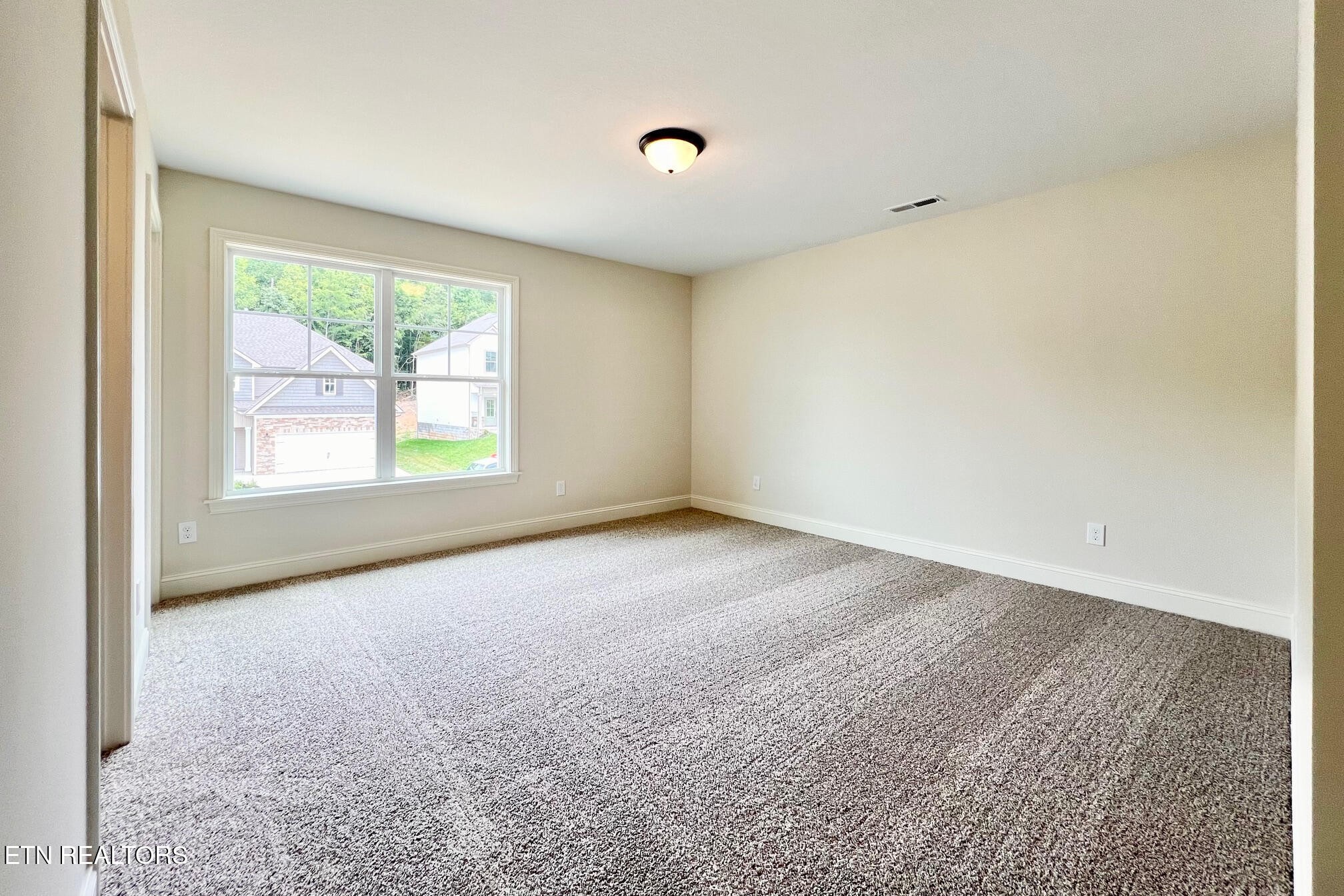 1209 Madison Oaks Road Knoxville, TN 37924 - Photo 29 of 35 an empty room with windows