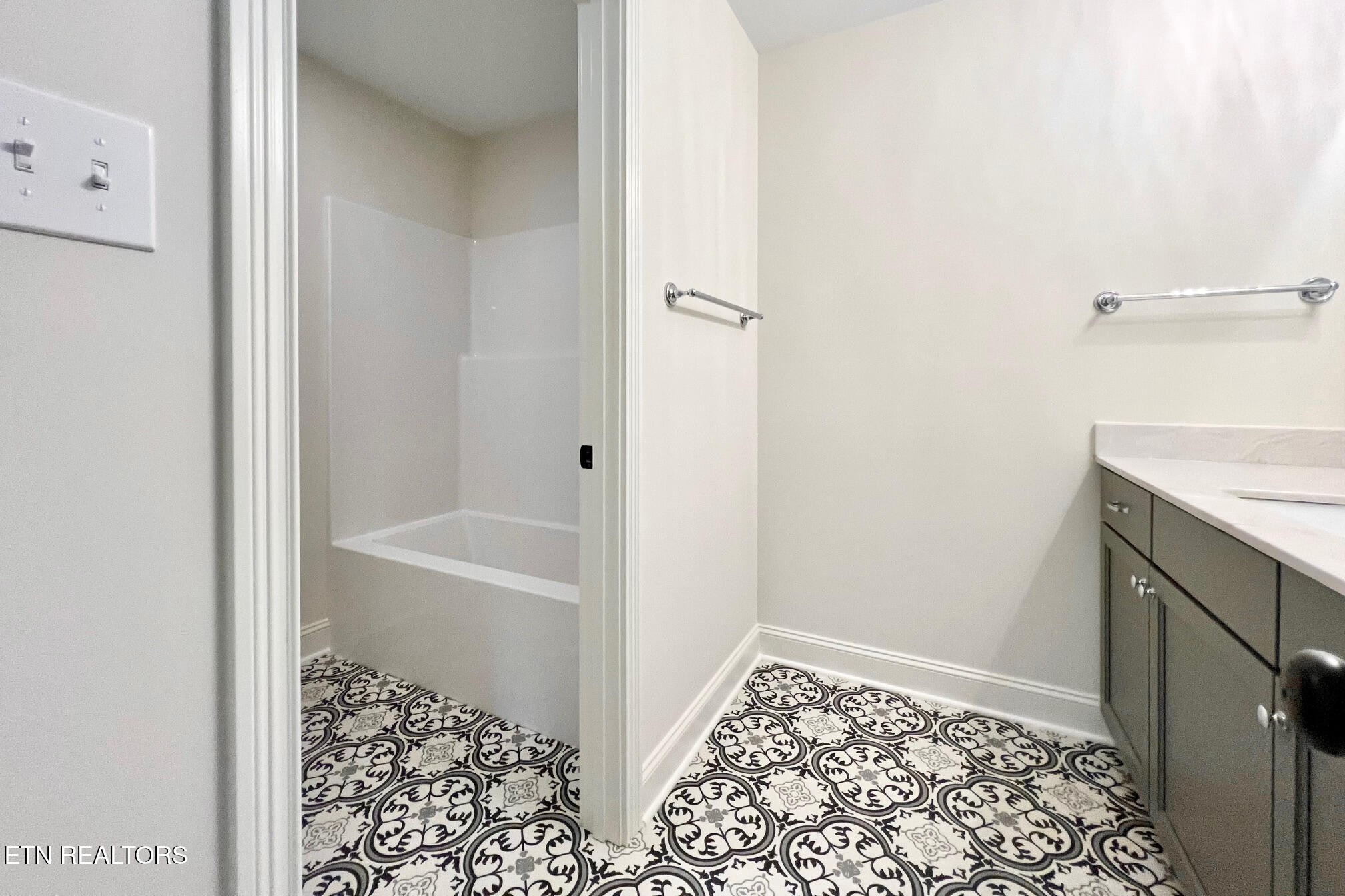 1209 Madison Oaks Road Knoxville, TN 37924 - Photo 32 of 35 a bathroom with a sink and a bath tub