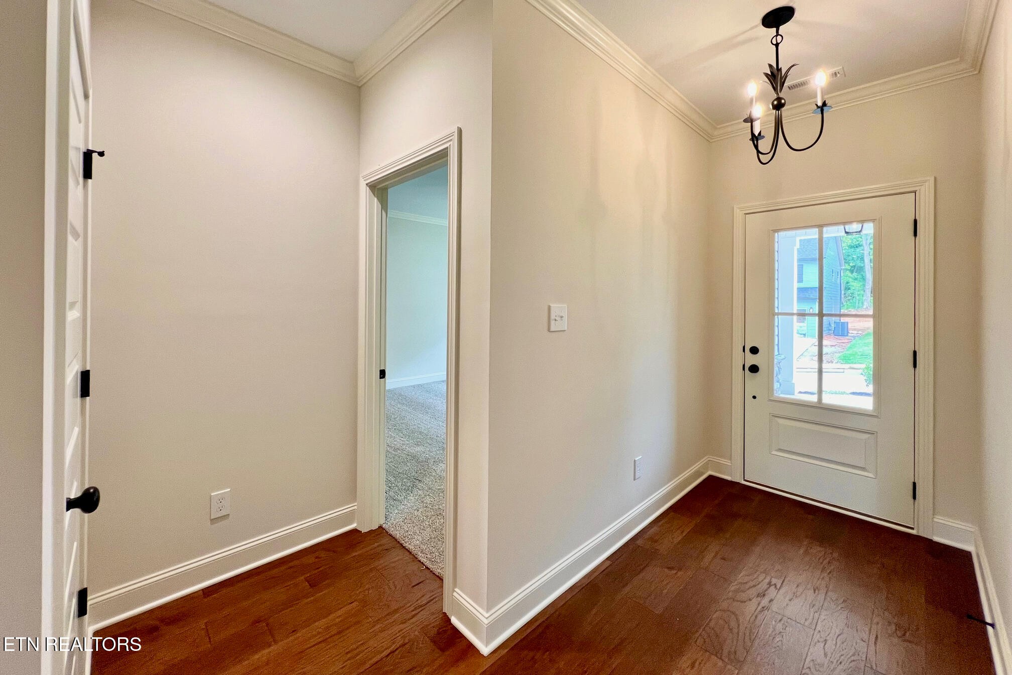 1209 Madison Oaks Road Knoxville, TN 37924 - Photo 4 of 35 a view of empty room with wooden floor and fan