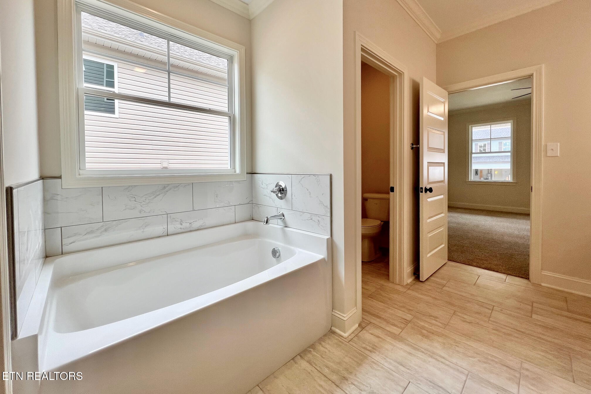 1209 Madison Oaks Road Knoxville, TN 37924 - Photo 10 of 35 a spacious bathroom with a bathtub and a shower