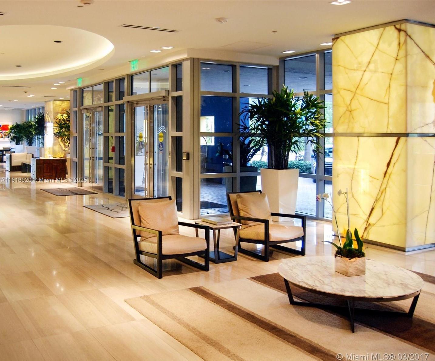 1330 West Avenue, Unit 2513 Miami Beach, FL 33139 - Photo 18 of 20 a living room with furniture and wooden floor