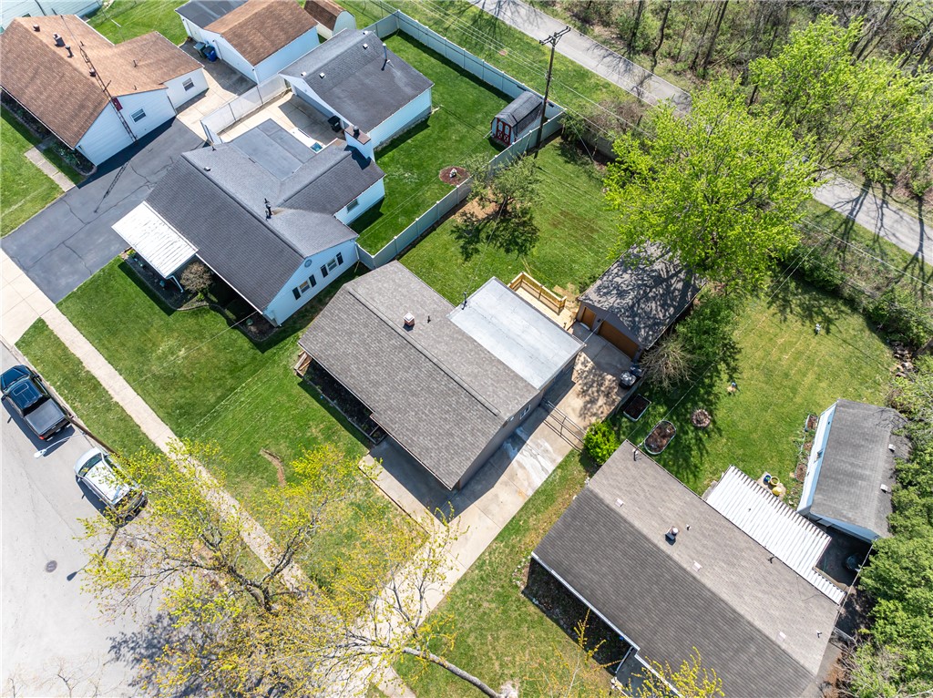 5240 Haverfield Road Dayton, OH 45432 - Photo 55 of 58 An aerial view showcases this residential neighborhood, featuring homes with diverse roofing and well-maintained yards.