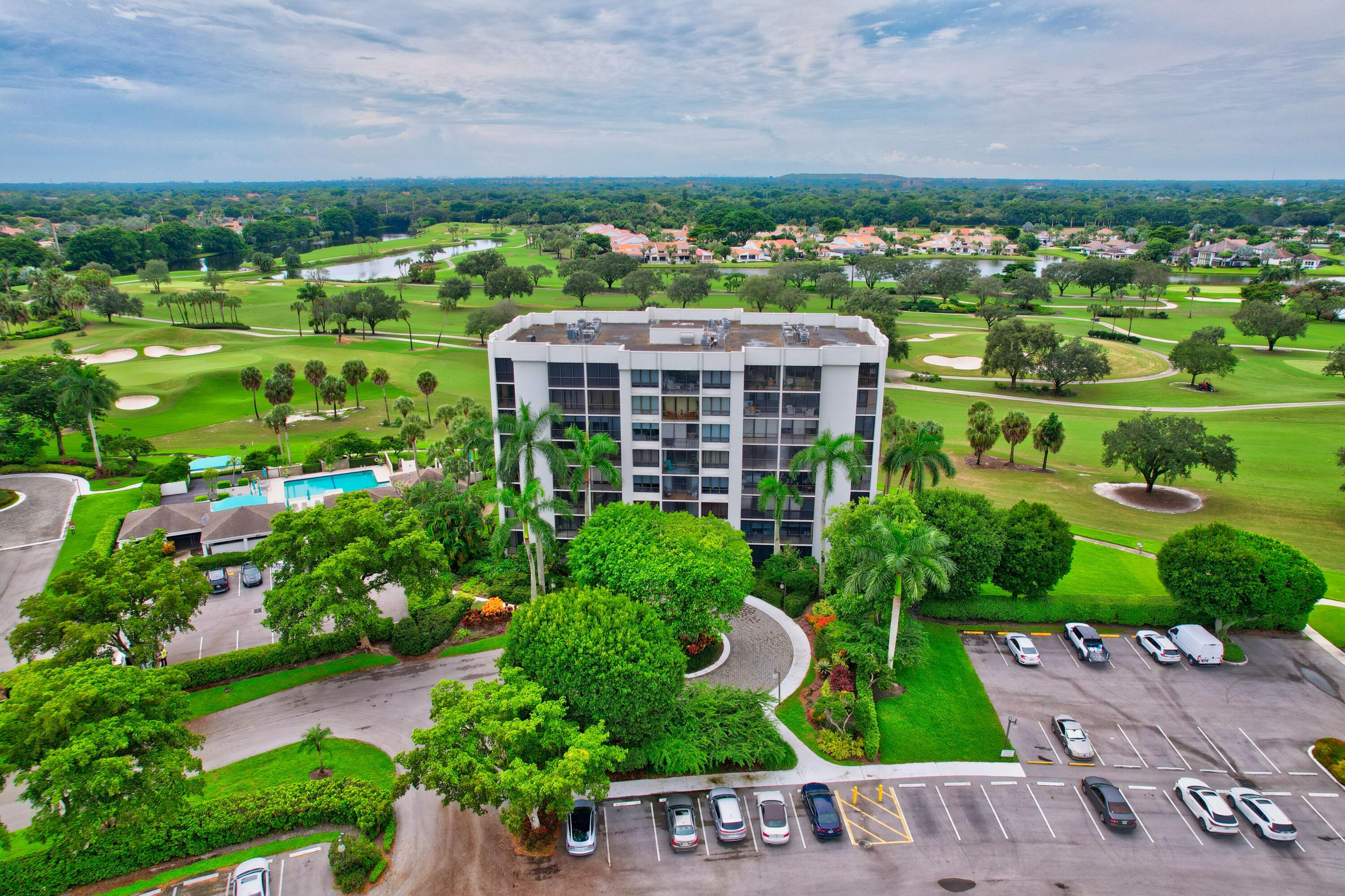 6805 Willow Wood Drive, Unit 5014 Boca Raton, FL 33434 - Photo 50 of 51 a view of a city with a building in the background