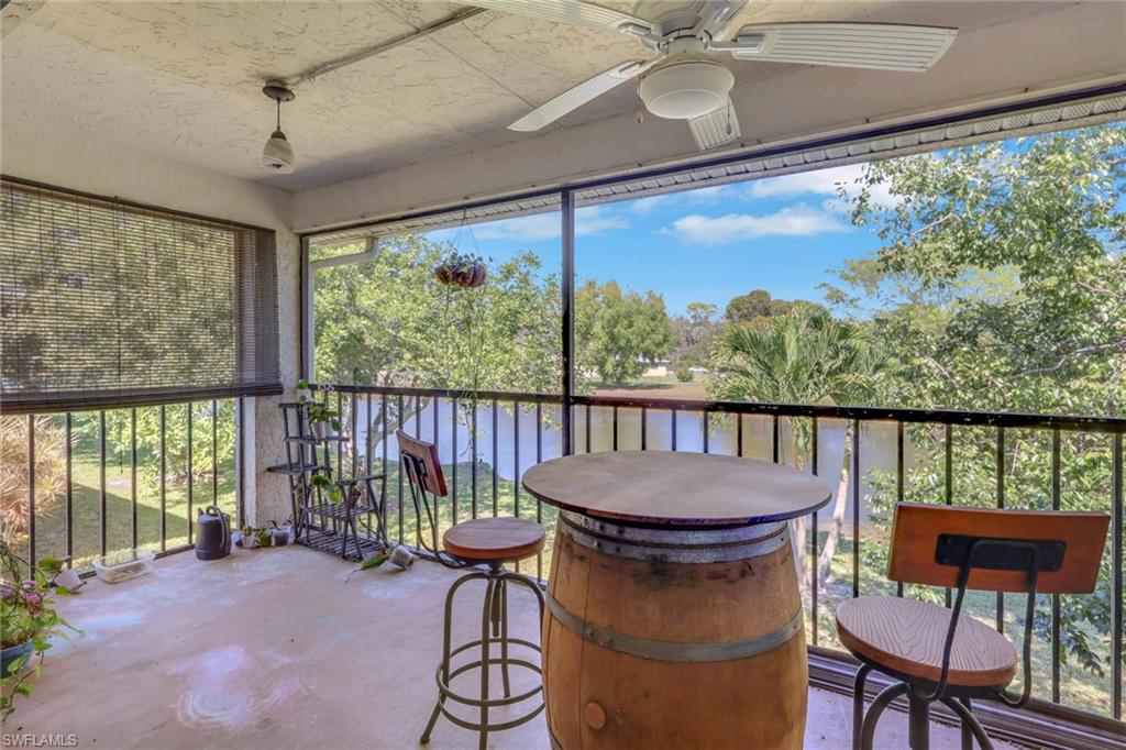 1211 Commonwealth Circle, Unit C201 Naples, FL 34116 - Photo 14 of 23 a view of a balcony with chairs