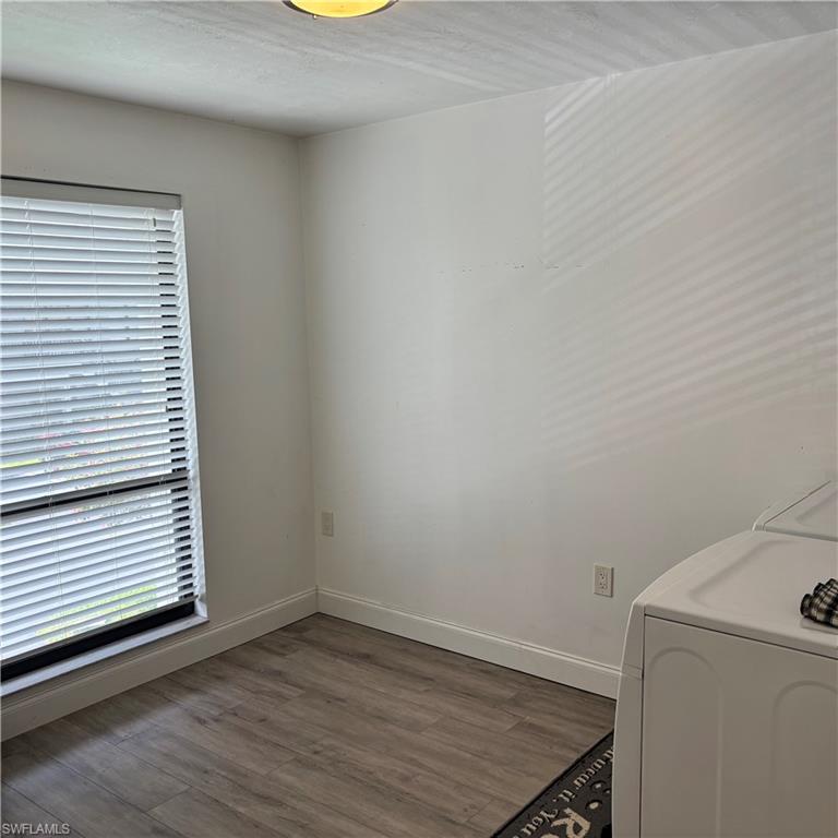 1211 Commonwealth Circle, Unit C201 Naples, FL 34116 - Photo 8 of 23 an empty room with a window