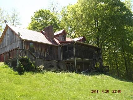 323 Spring Creek Road Lawrenceburg, TN 38464 - Photo 1 of 13 a view of a backyard