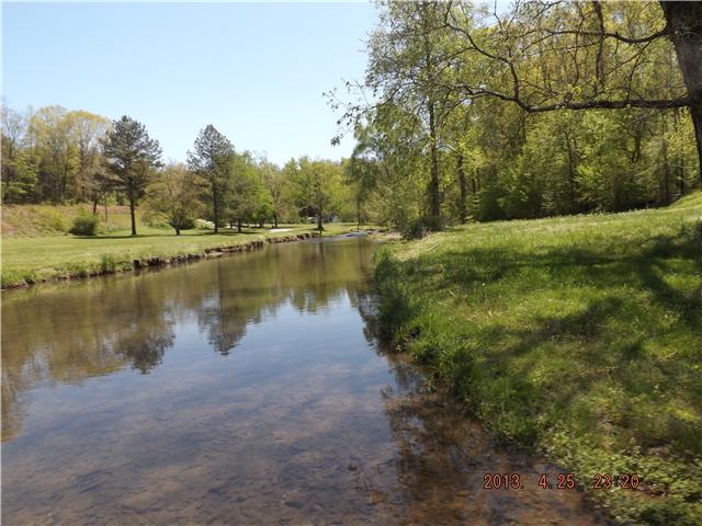 323 Spring Creek Road Lawrenceburg, TN 38464 - Photo 2 of 13 a view of a lake with houses in outdoor space