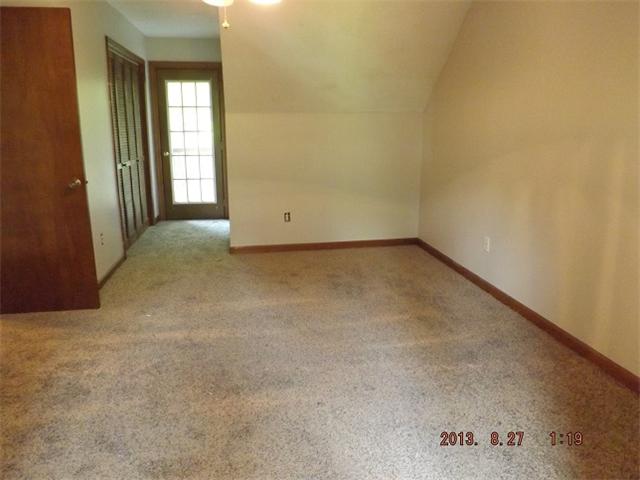 323 Spring Creek Road Lawrenceburg, TN 38464 - Photo 4 of 13 an empty room with windows