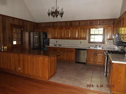 323 Spring Creek Road Lawrenceburg, TN 38464 - Photo 6 of 13 a kitchen with stainless steel appliances granite countertop a sink stove and refrigerator