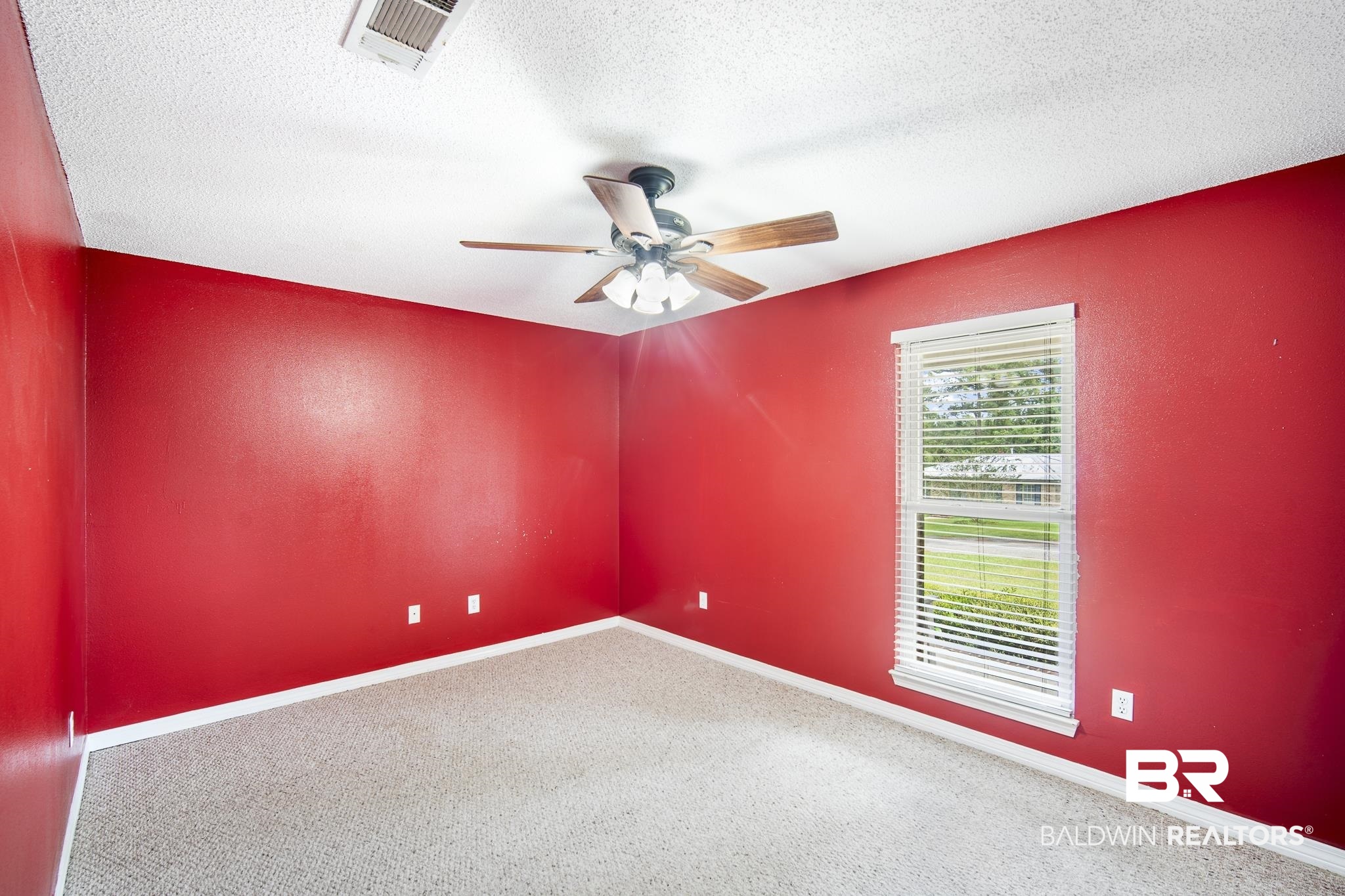 103 Ann Street Daphne, AL 36527 - Photo 15 of 23 Carpeted spare room featuring a textured ceiling and ceiling fan