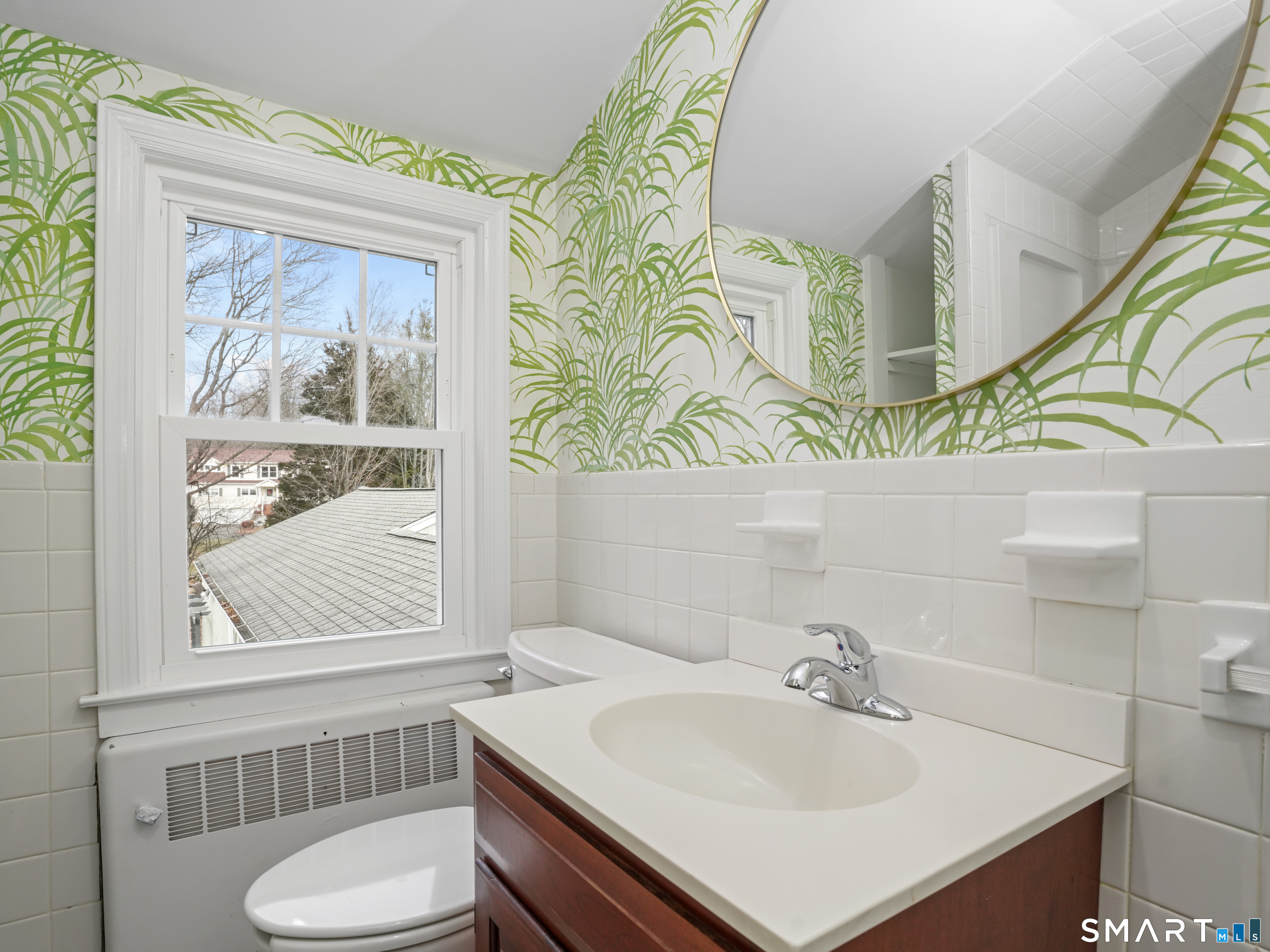 8 Raleigh Road Bridgeport, CT 06606 - Photo 14 of 20 a bathroom with a sink and a mirror