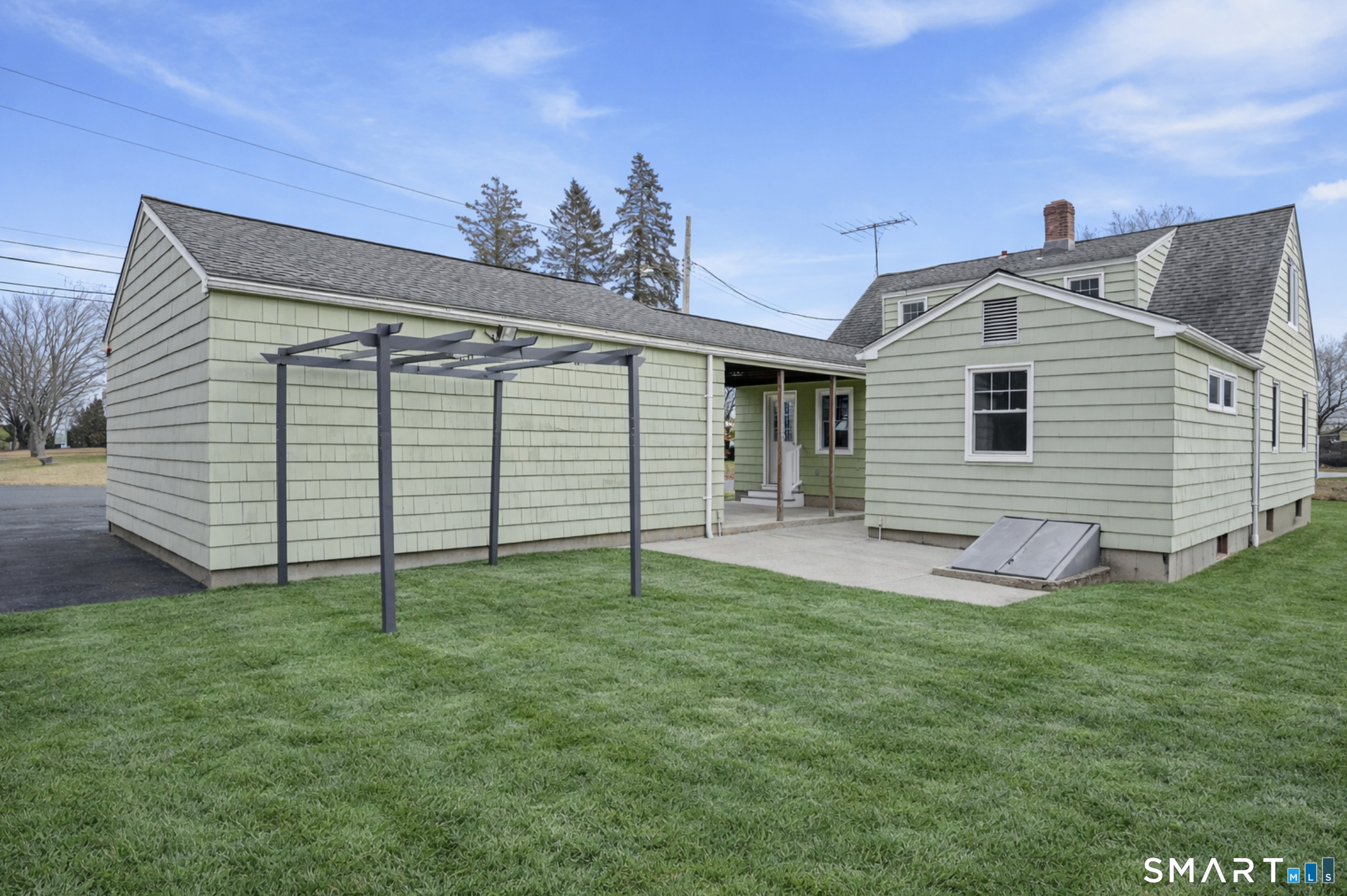 8 Raleigh Road Bridgeport, CT 06606 - Photo 16 of 20 a front view of a house with a yard