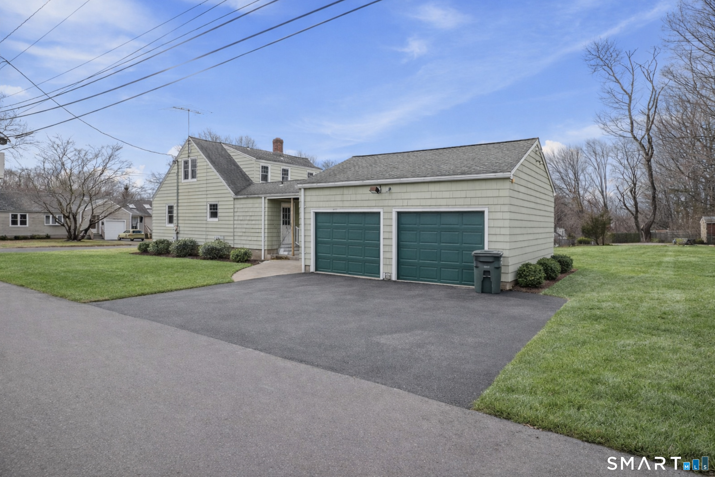 8 Raleigh Road Bridgeport, CT 06606 - Photo 17 of 20 a view of a house with a yard and garage