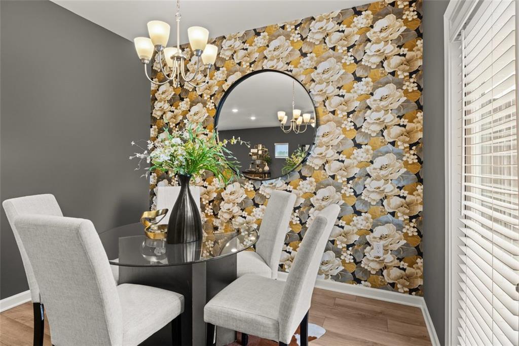 269 Epping Street, Unit 81 Stockbridge, GA 30281 - Photo 21 of 64 a view of a dining room with furniture and wooden floor