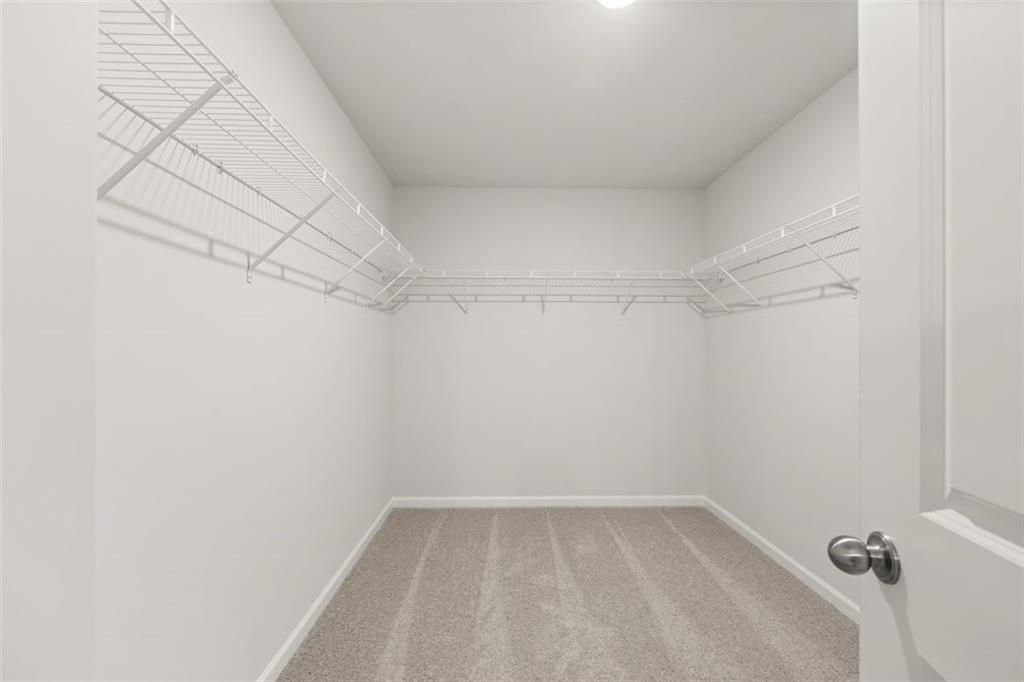 269 Epping Street, Unit 81 Stockbridge, GA 30281 - Photo 47 of 64 a view of a room with racks on the wall