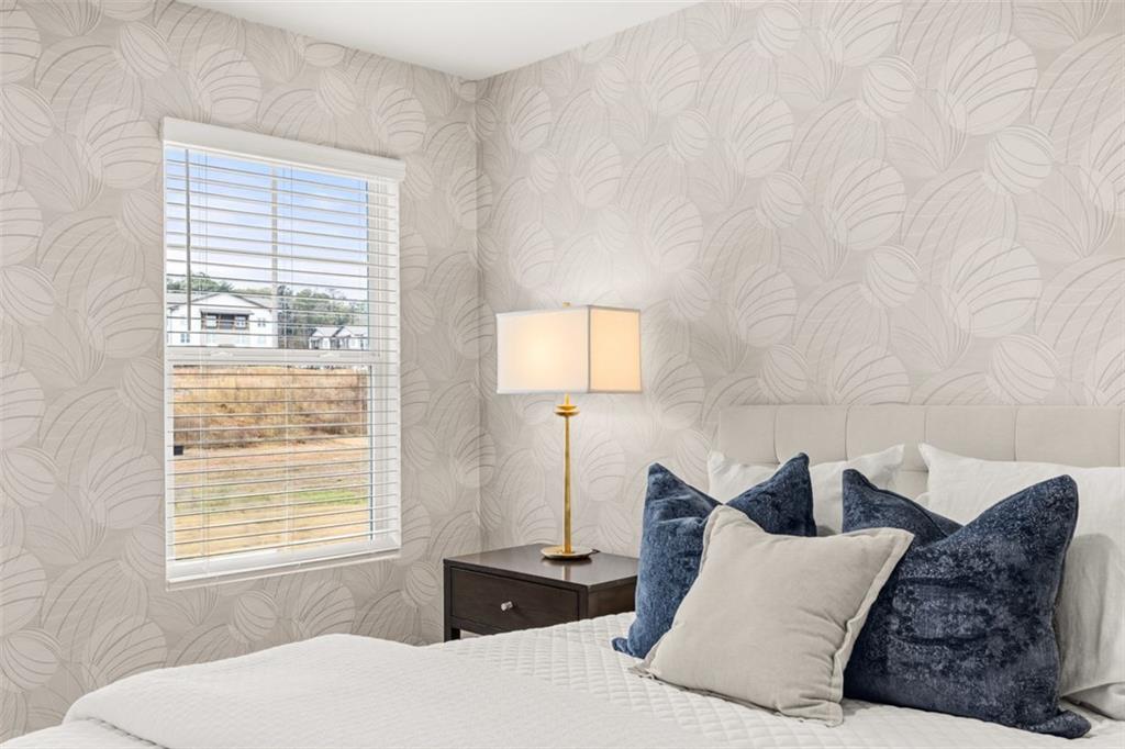 269 Epping Street, Unit 81 Stockbridge, GA 30281 - Photo 49 of 64 a bedroom with a bed and a window