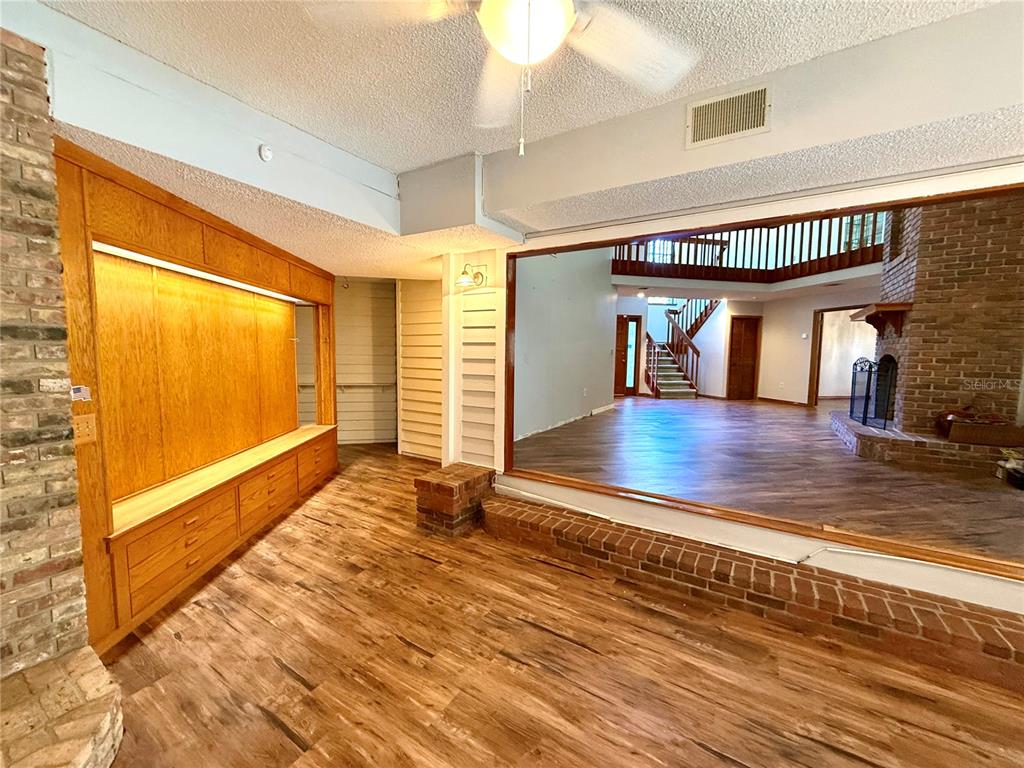 2395 Windward Cove Kissimmee, FL 34746 - Photo 13 of 62 a view of lobby with an empty room and wooden floor