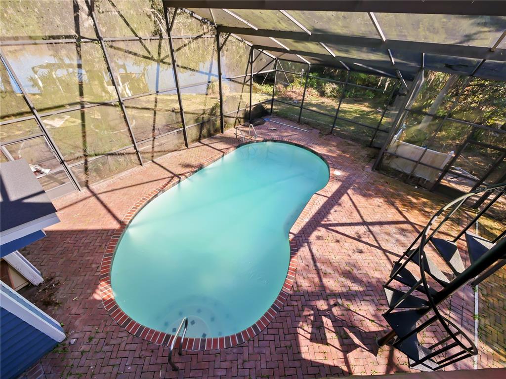 2395 Windward Cove Kissimmee, FL 34746 - Photo 35 of 62 a view of a swimming pool with a patio