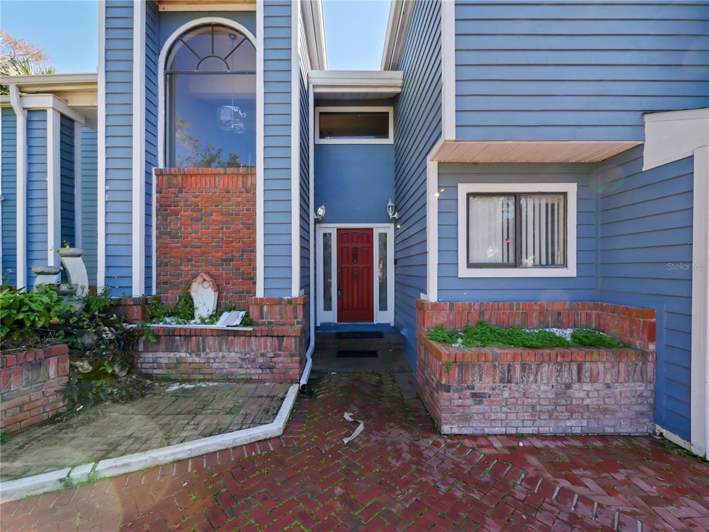 2395 Windward Cove Kissimmee, FL 34746 - Photo 4 of 62 a front view of a house having yard