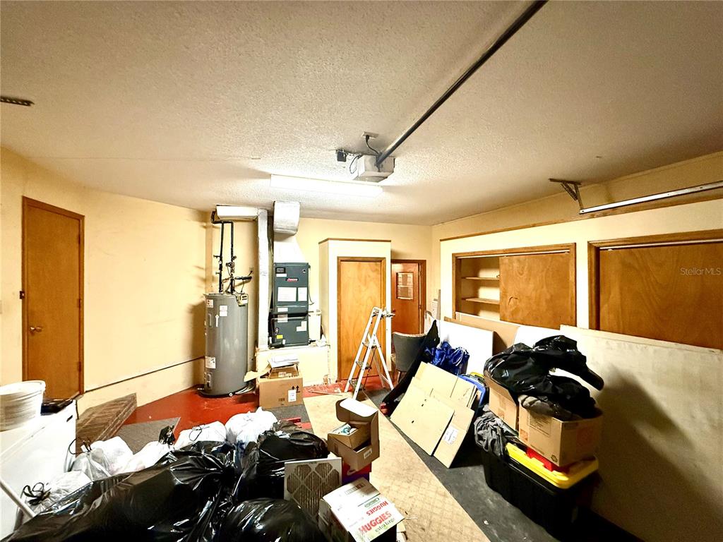 2395 Windward Cove Kissimmee, FL 34746 - Photo 49 of 62 a bed room with furniture and a window