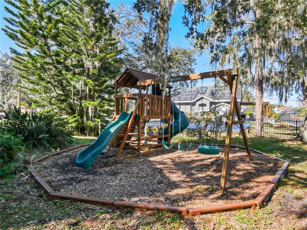 2395 Windward Cove Kissimmee, FL 34746 - Photo 56 of 62 a view of a park with swings