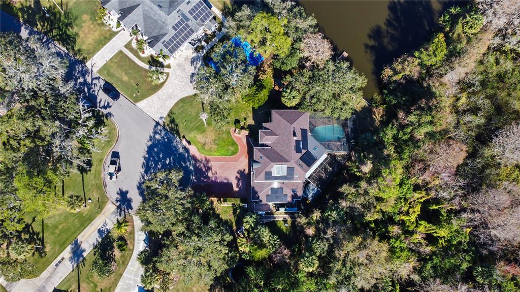2395 Windward Cove Kissimmee, FL 34746 - Photo 60 of 62 an aerial view of a house with a yard and garden
