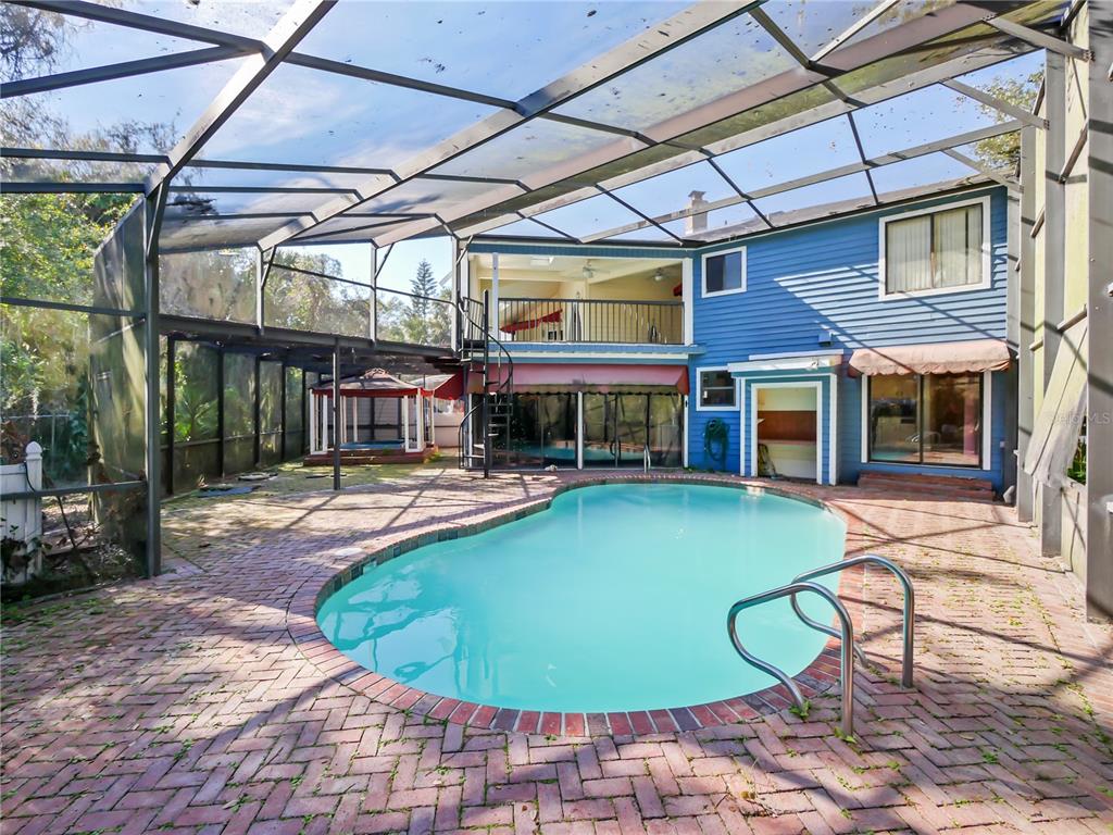 2395 Windward Cove Kissimmee, FL 34746 - Photo 7 of 62 a view of a swimming pool with a patio