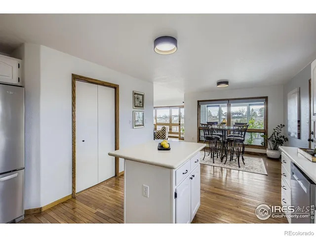 a kitchen with a table and chairs