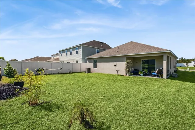 a view of a house with garden and yard