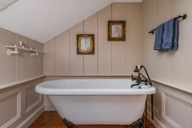 a white bath tub sitting in a bathroom