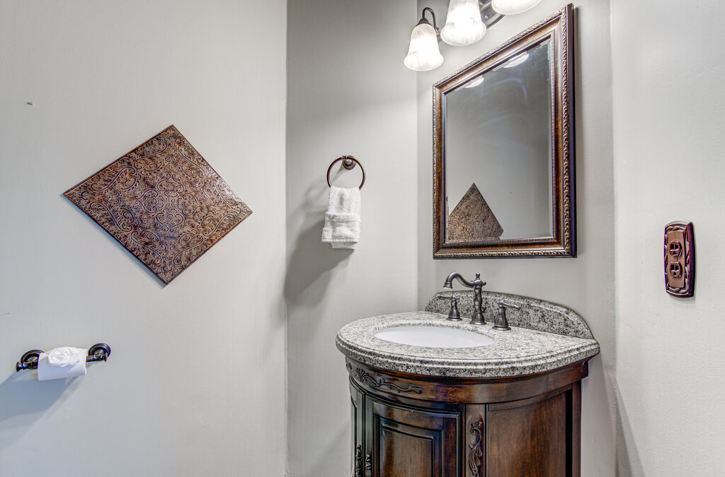 7712 Earp Way Austin, TX 78729 - Photo 18 of 40 a bathroom with a sink and a mirror