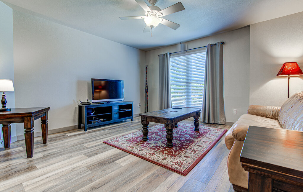 7712 Earp Way Austin, TX 78729 - Photo 26 of 40 a living room with furniture and a wooden floor