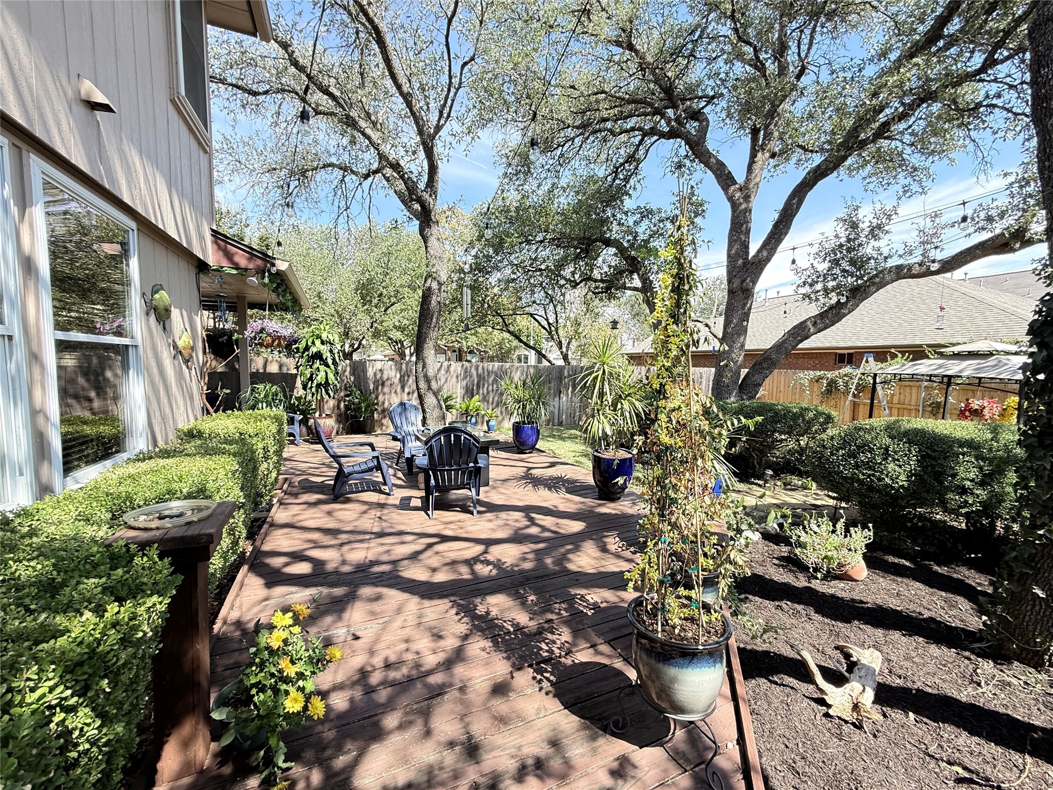 7712 Earp Way Austin, TX 78729 - Photo 35 of 40 a view of a chairs and tables in the patio