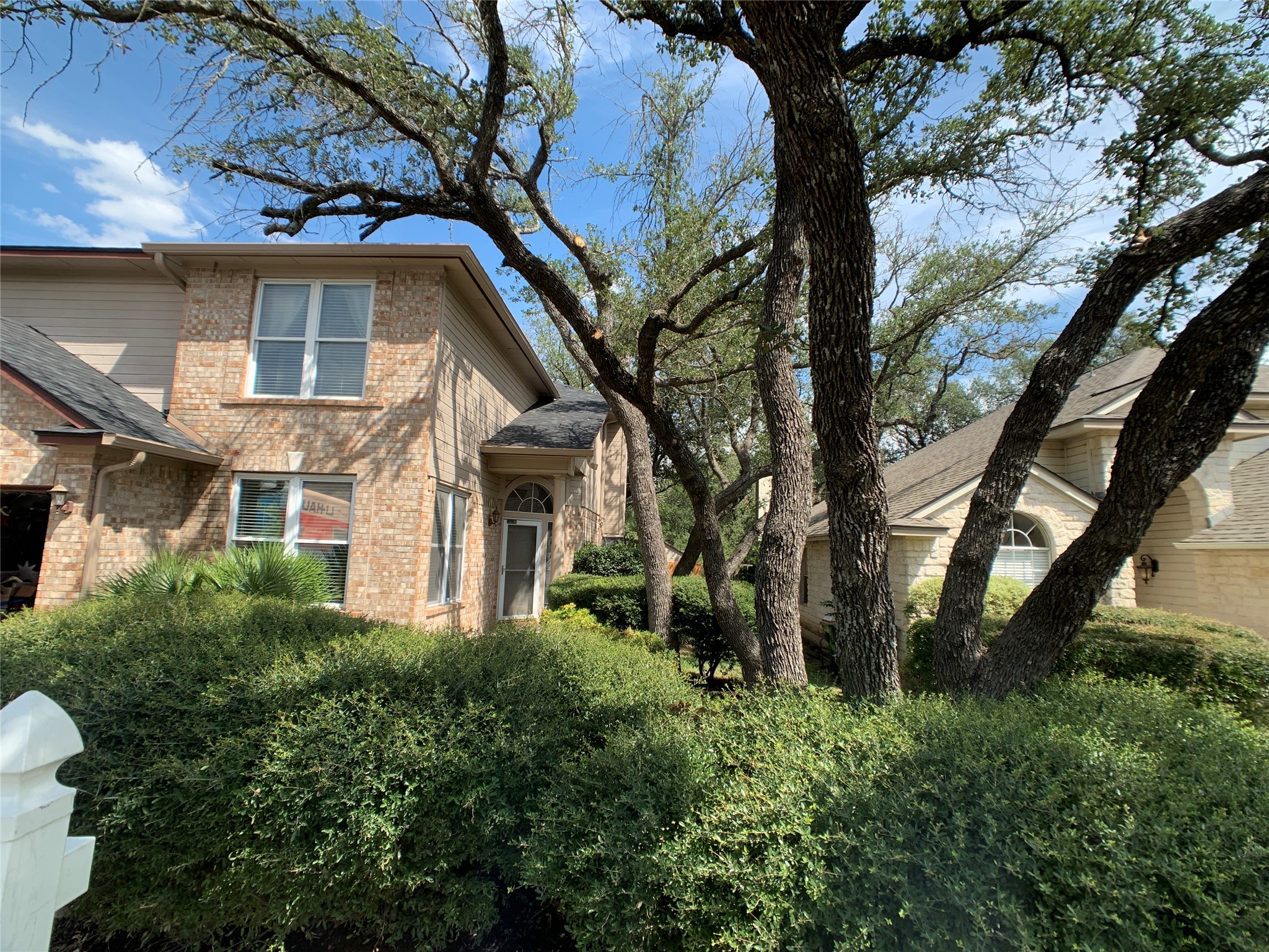 7712 Earp Way Austin, TX 78729 - Photo 4 of 40 a view of a house with a tree