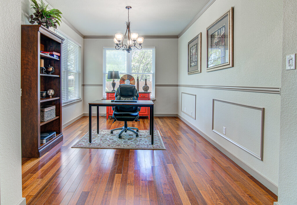 7712 Earp Way Austin, TX 78729 - Photo 10 of 40 a living room with furniture and a wooden floor