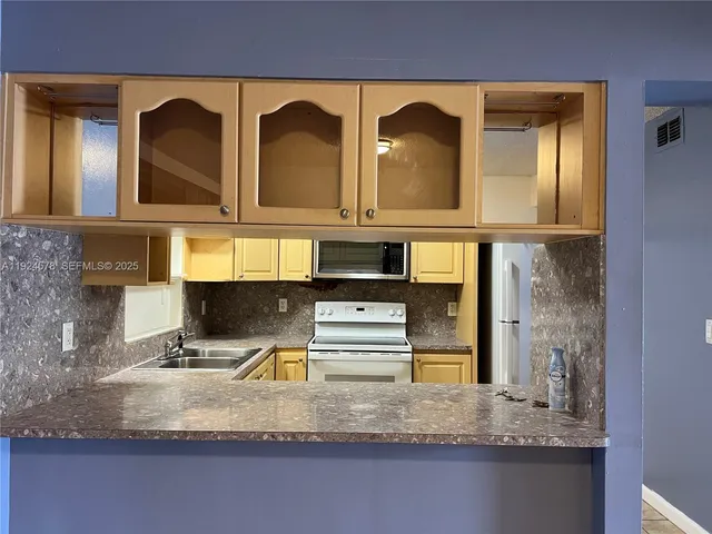 a bathroom with mirror and bathtub
