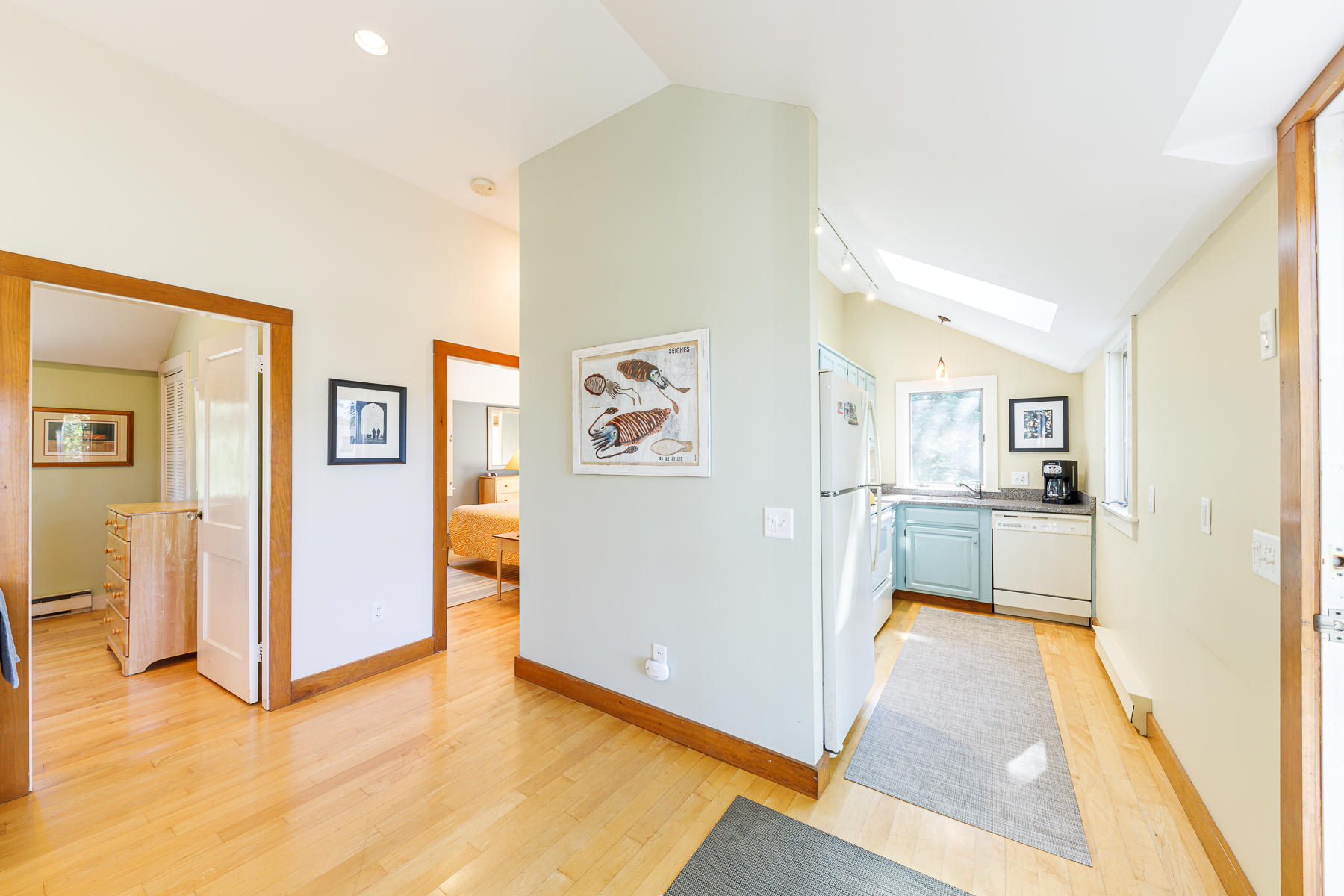 295 Mill Road Eastham, MA 02642 - Photo 13 of 33 a view of a kitchen with refrigerator and wooden floor