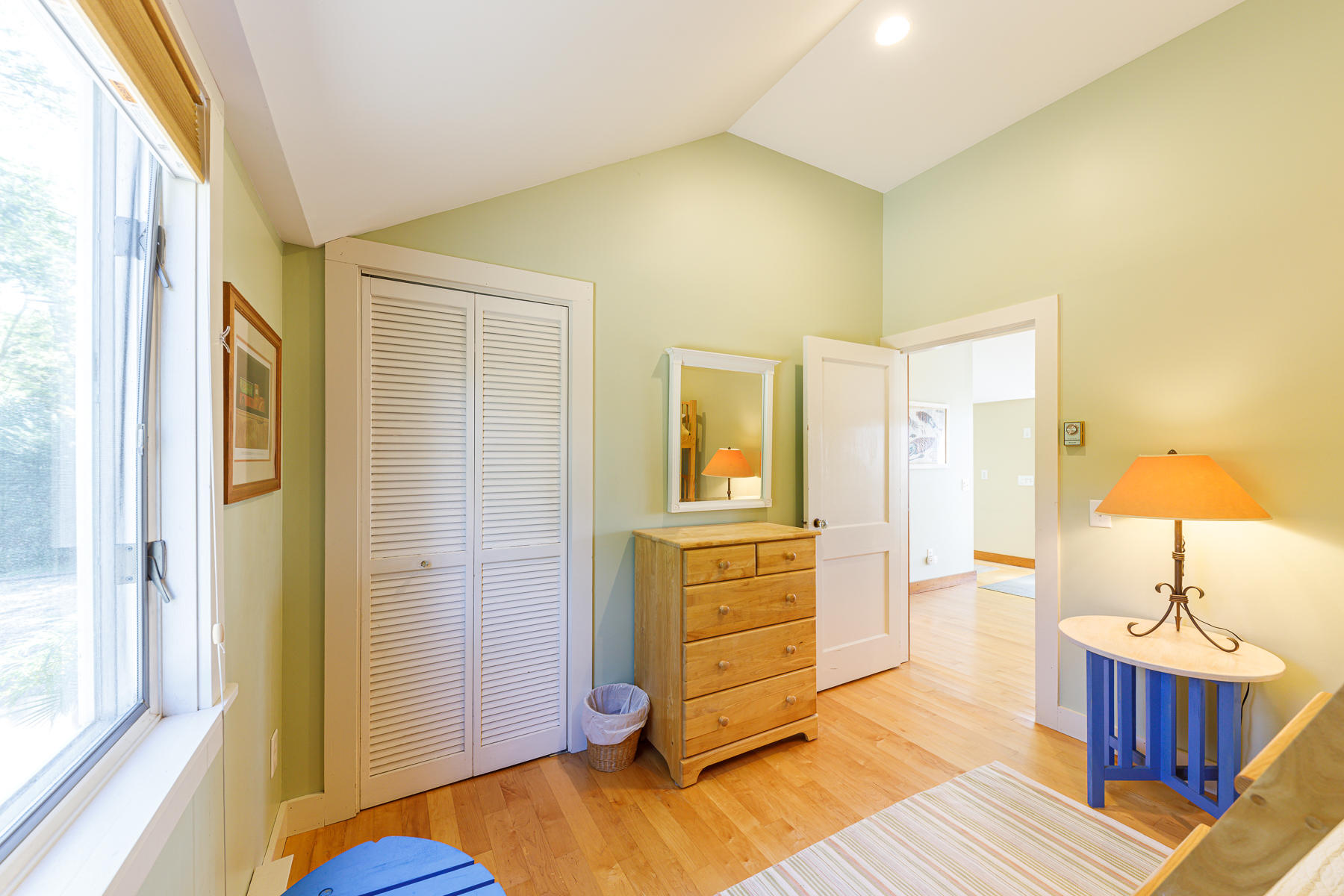 295 Mill Road Eastham, MA 02642 - Photo 16 of 33 a bedroom with a bed and wooden floor
