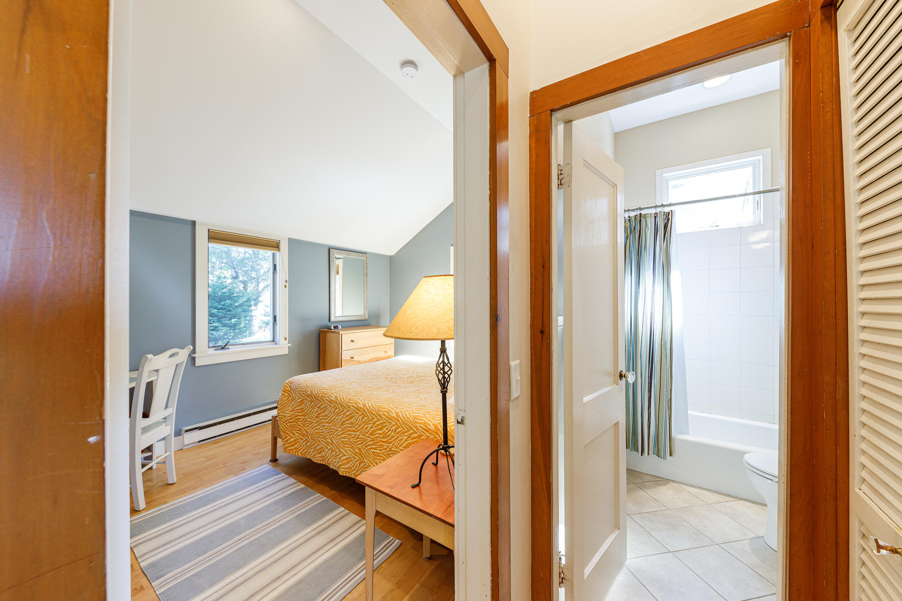 295 Mill Road Eastham, MA 02642 - Photo 17 of 33 a bedroom with a bed and wooden floor