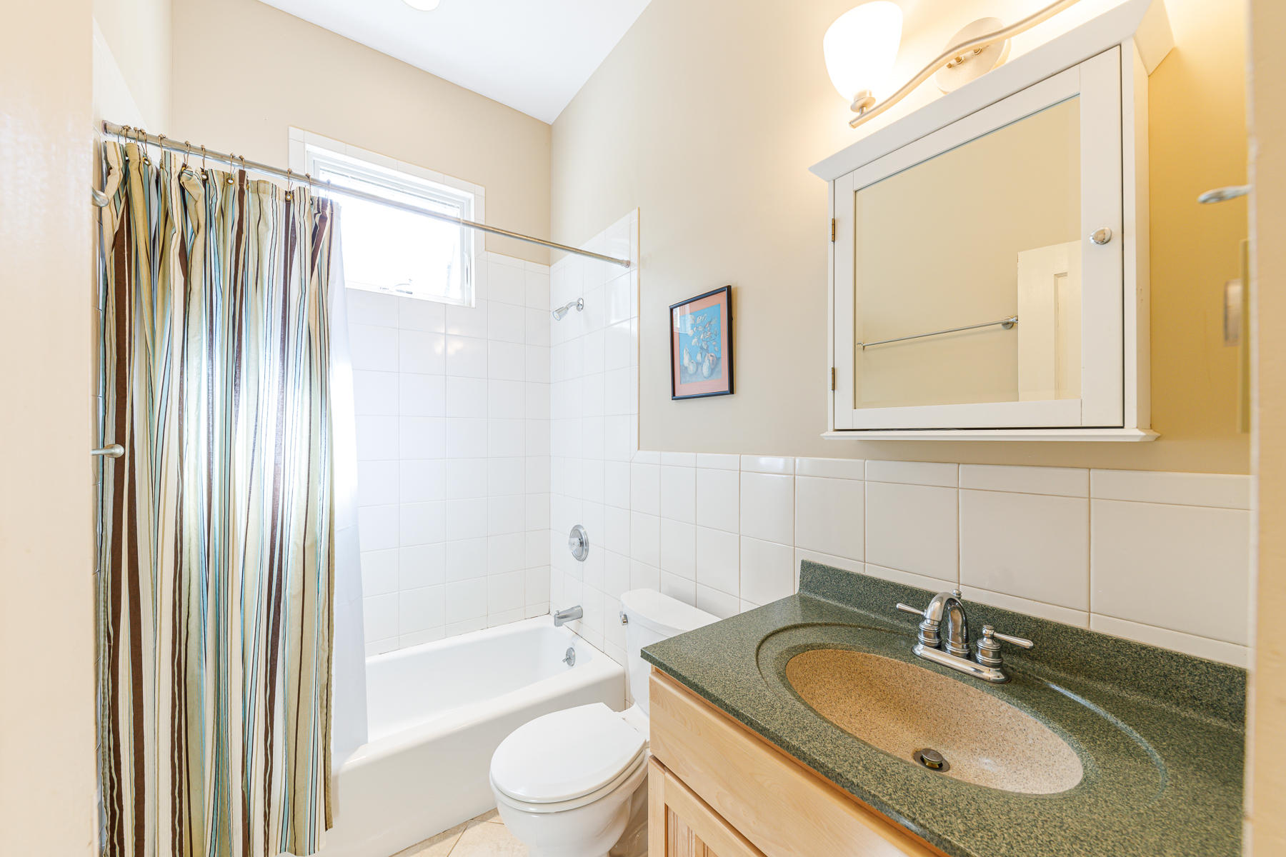 295 Mill Road Eastham, MA 02642 - Photo 19 of 33 a bathroom with a granite countertop sink toilet and shower